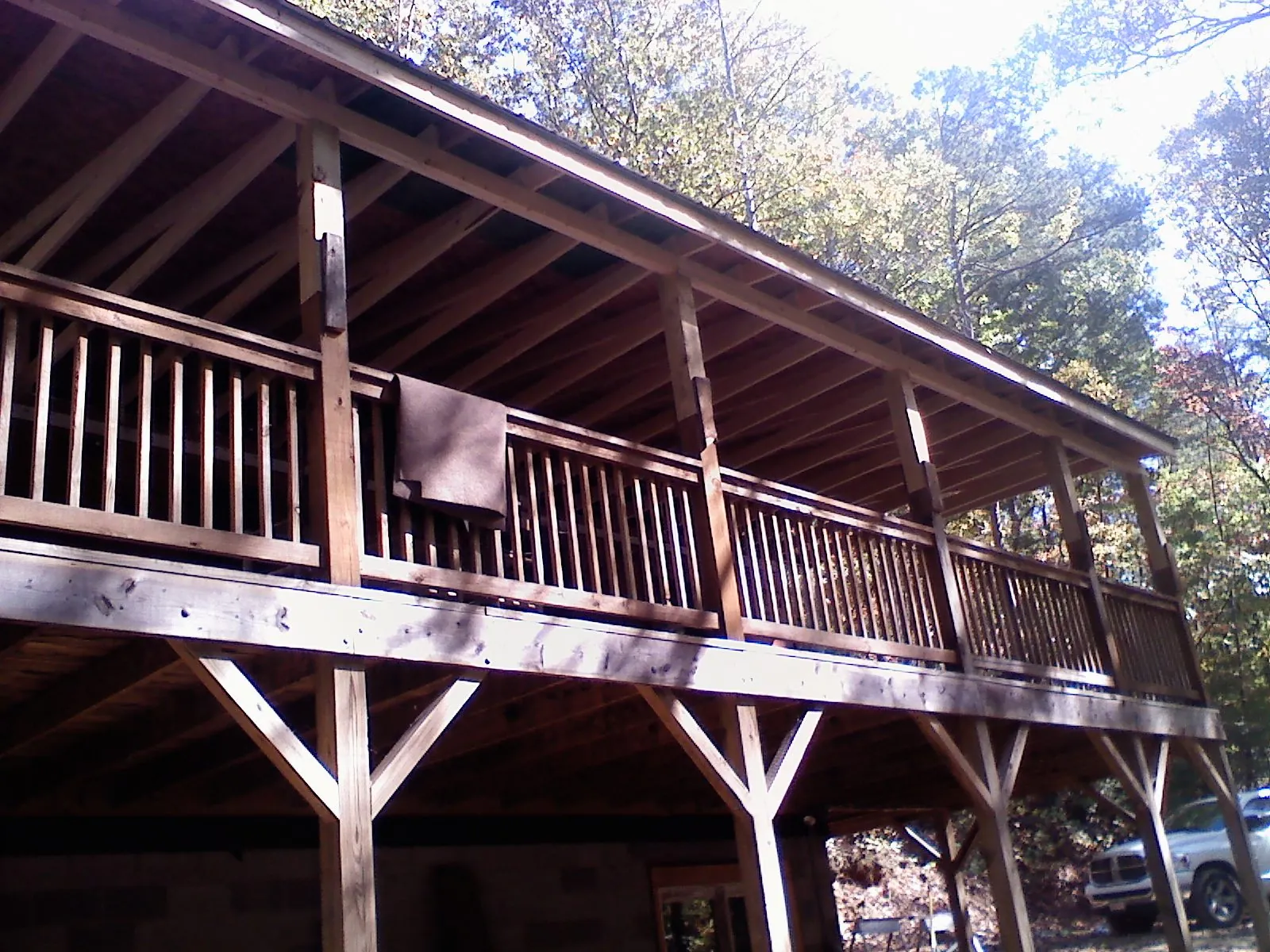 Timber framing under a new elevated porch and deck — Roof Leak Repair in Pittsford by Roofing Brothers